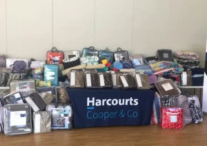a printed Harcourts table cover