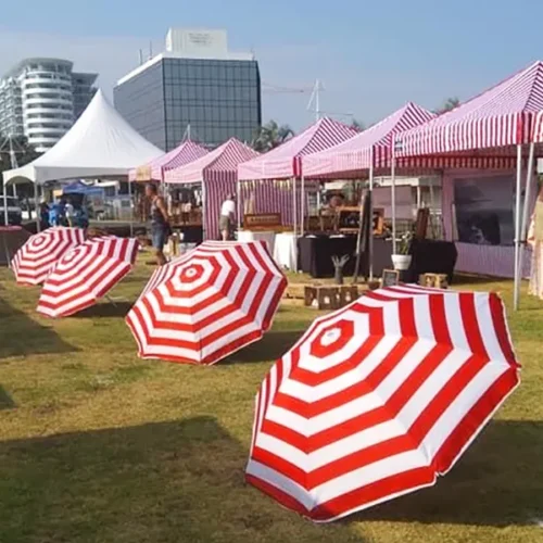 striped gazebos with umbrellas
