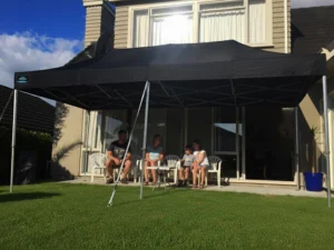 family siting under the gazebo by the property