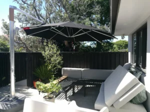 a cantilever umbrella set up at the backyard