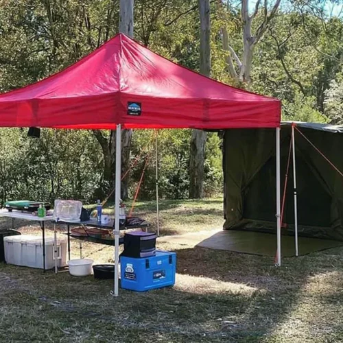 A camping gazebo in action - red