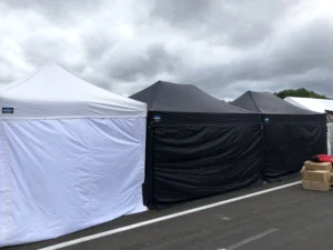 A line-up of gazebos at an outdoor event.