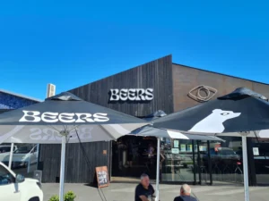 Two branded outdoor umbrellas for Beer by Bacon Bros