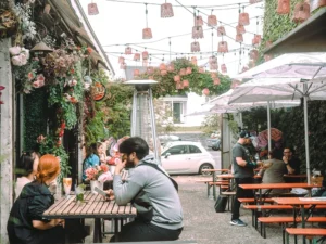 Three branded outdoor umbrellas in white for a cafe in Ponsonby Auckland