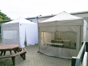 Two plain pop-up gazebos with sides for Epsom Grammar School