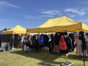 Two yellow pop up gazebos in an Auckland event