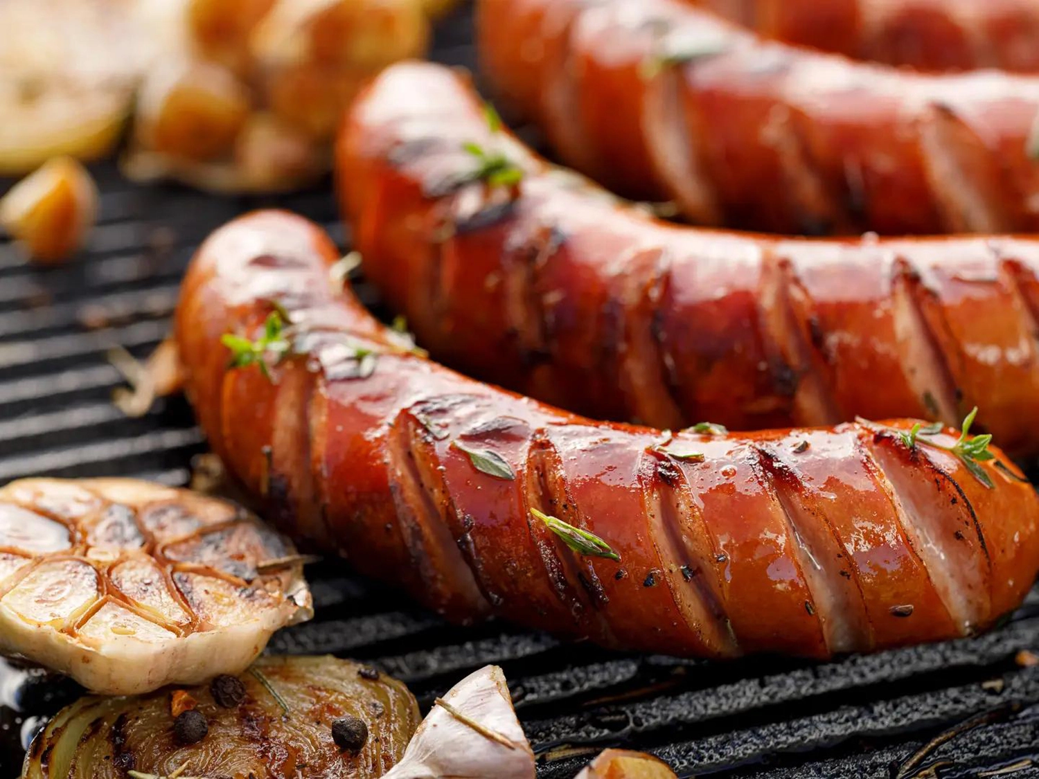 Outdoor cooking - sausages on grill