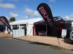 Branded Hercules gazebo display with feather flags set up at a New Zealand A&P agricultural show