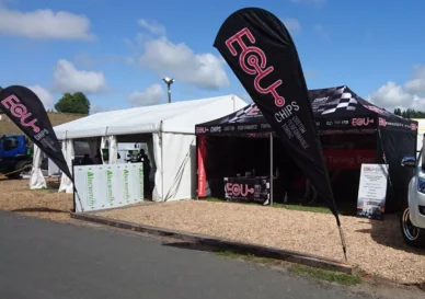 Branded Hercules gazebo display with feather flags set up at a New Zealand A&P agricultural show
