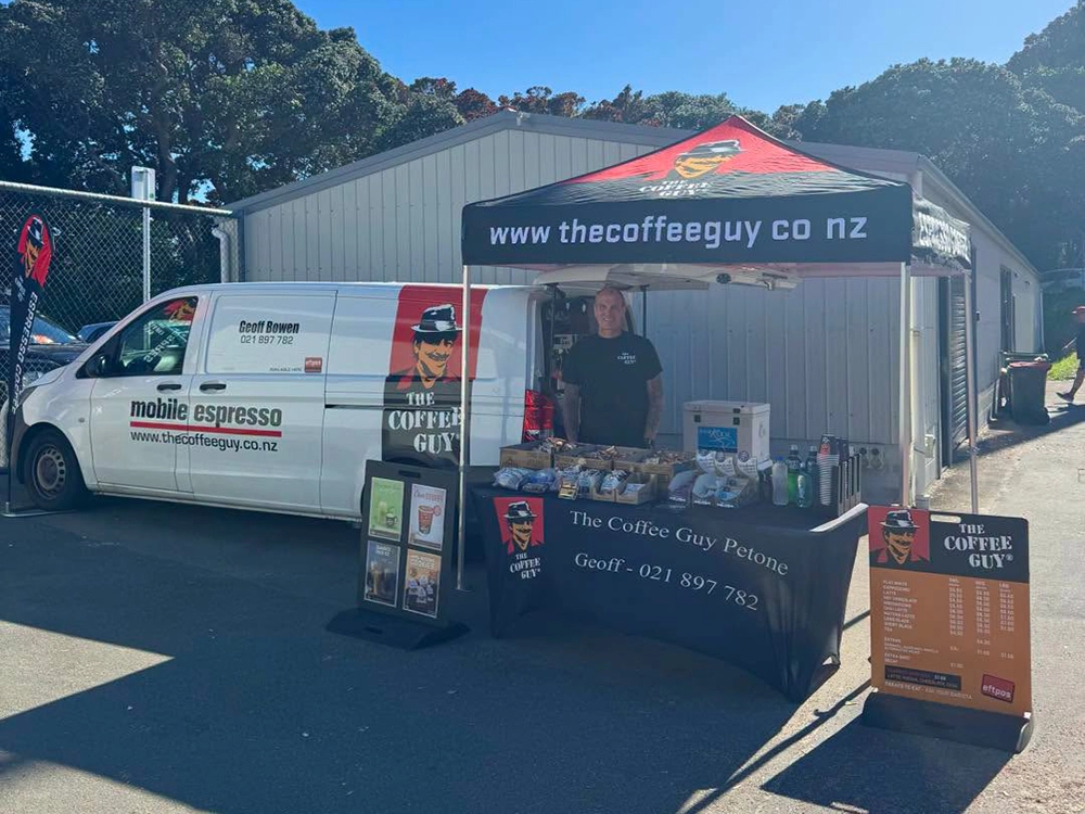 Coffee Guy Petone logoed Hercules gazebo standing out among vendor gazebos at a Wellington outdoor event