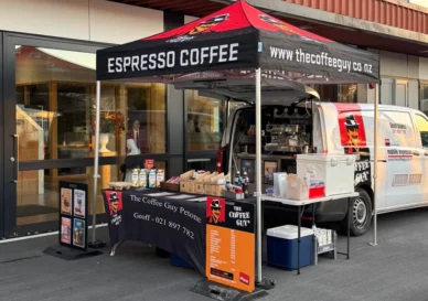 Coffee Guy Petone branded Hercules gazebo set up alongside the coffee van at a Wellington outdoor event