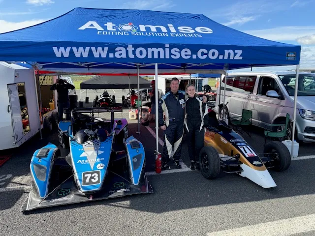 Sponsor logo printed on a Hercules gazebo canopy at a New Zealand sports event